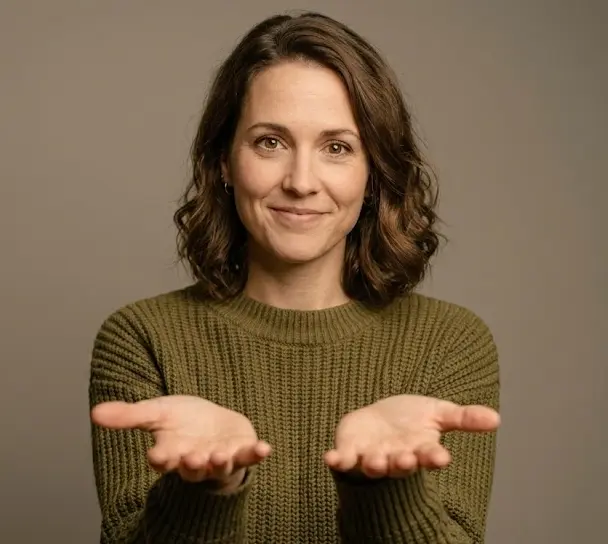 Person showing open palms facing upward as a gesture of honesty and openness in body language