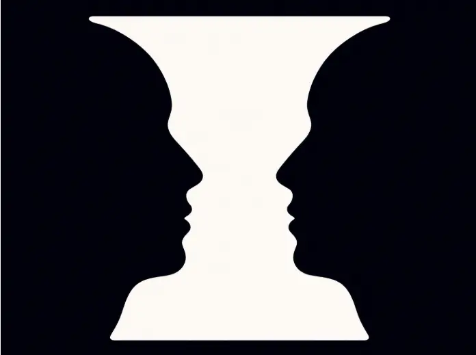Rubin's Vase optical illusion showing either a white vase or two dark faces looking at each other
